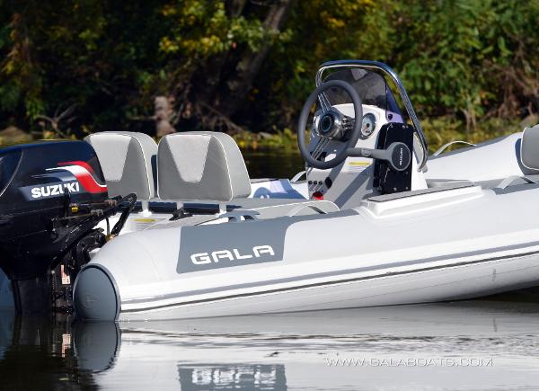 Slide: The Image of 2025 Gala V360 boat with Suzuki engine on calm water, featuring sleek design and modern steering. - 4