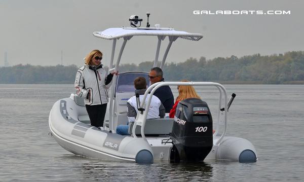Slide: The Image of 2024 Gala VIKING V500 boat with Mercury 100 engine on a calm lake. - 2