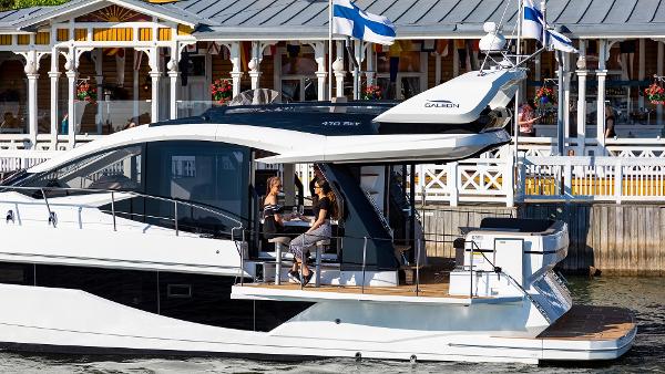 Slide: The Image of 2023 Galeon 470 Sky yacht docked with people on deck. - 9