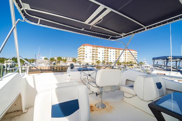 Slide: The Image of 2003 Gibson 47 Classic boat interior with marina view and modern seating. - 15