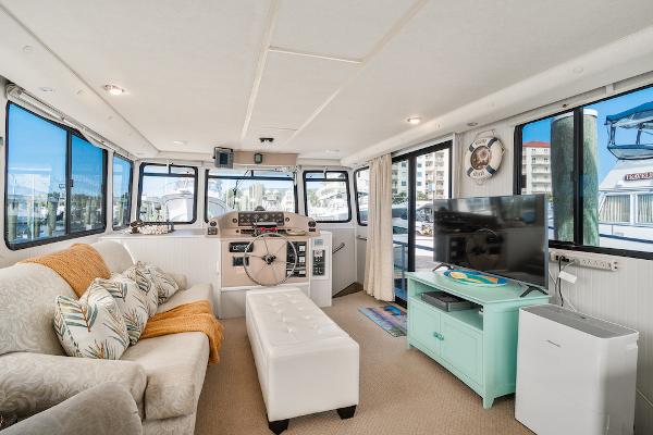 Slide: The Image of Interior of 2003 Gibson 47 Classic houseboat with cozy seating and modern amenities. - 20