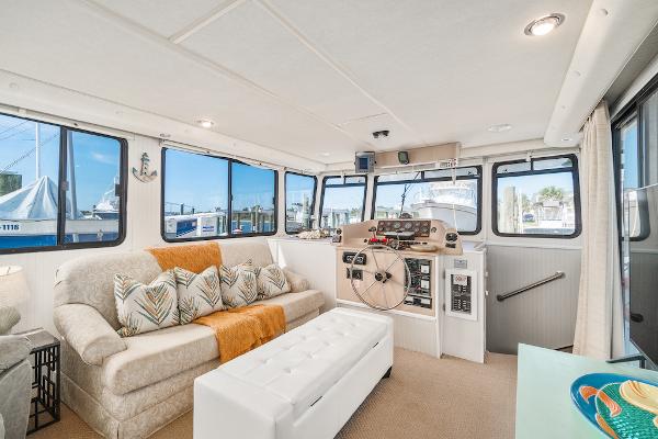 Slide: The Image of Spacious interior of 2003 Gibson 47 Classic boat with helm and seating area. - 21