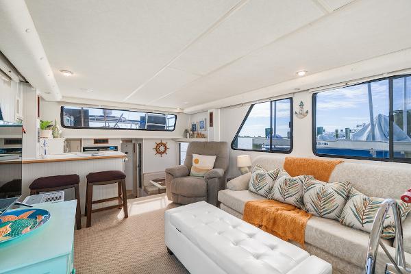 Slide: The Image of Spacious interior of 2003 Gibson 47 Classic yacht with modern decor and large windows. - 23