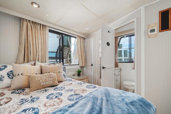 Slide: The Image of Cozy bedroom in 2003 Gibson 47 Classic boat with nautical decor and window view. - 33