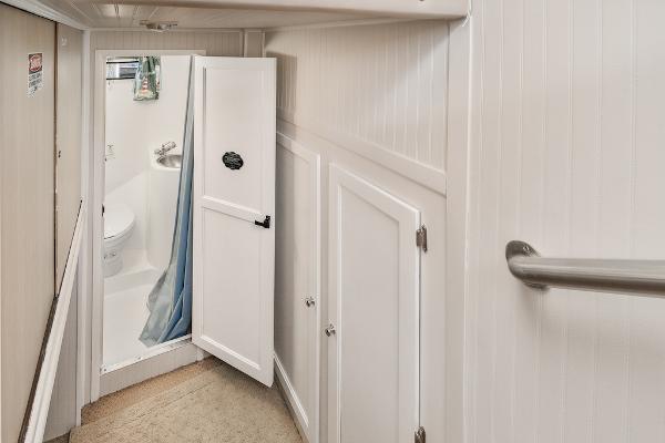 Slide: The Image of Narrow bathroom with shower in 2003 Gibson 47 Classic boat. - 34