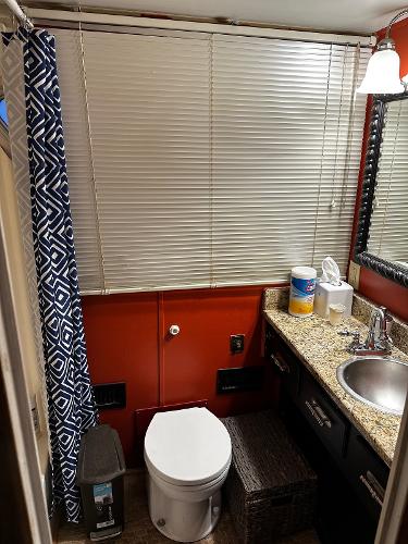 Slide: The Image of 1987 Gibson 50 Classic bathroom with granite countertop, sink, toilet, and window blinds. - 27