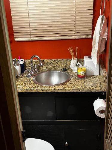 Slide: The Image of 1987 Gibson 50 Classic bathroom with granite countertop and stainless steel sink. - 35