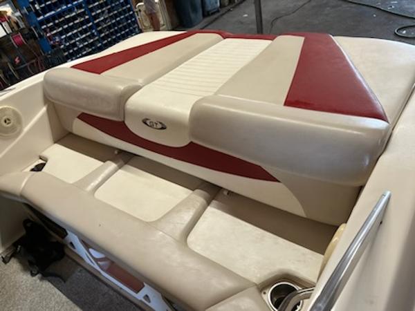 Slide: The Image of 2007 Glastron GT185 boat interior with red and beige seating. - 11