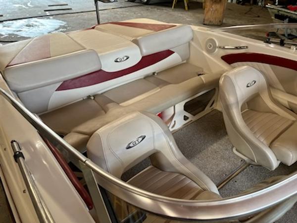 Slide: The Image of 2007 Glastron GT185 boat interior with beige and red seating. - 6