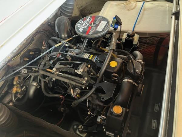 Slide: The Image of 2007 Glastron GT185 engine compartment with 3.0L MerCruiser engine, detailed view. - 7