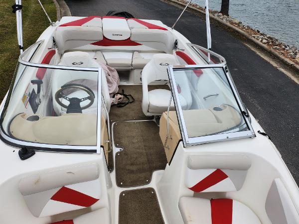 Slide: The Image of 2008 Glastron GT 205 boat interior with red and white seating. - 20