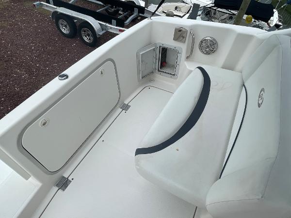 Slide: The Image of 2009 Glastron GT 249 boat interior with seating and storage compartments. - 3