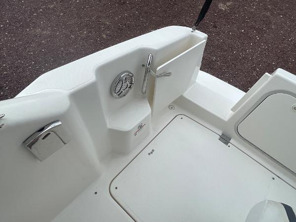 Slide: The Image of 2009 Glastron GT 249 boat deck with storage compartments and fixtures. - 4