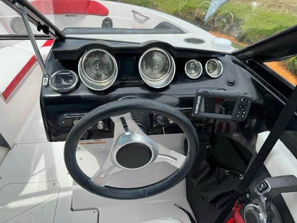 Slide: The Image of 2018 Glastron GTD 200 boat dashboard with steering wheel and gauges. - 4