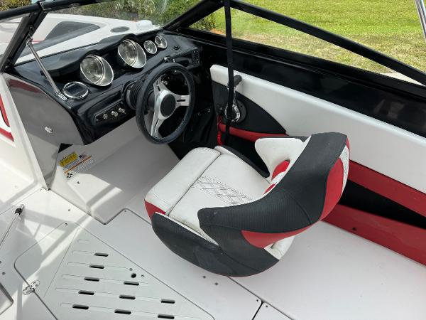 Slide: The Image of 2018 Glastron GTD 200 boat interior with steering wheel and captain's seat. - 7