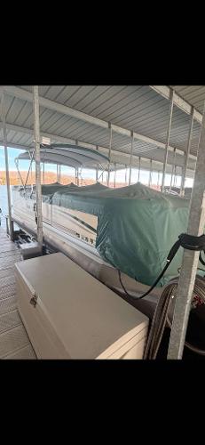 Slide: The Image of 2005 Godfrey AquaPatio 240 LE pontoon boat covered in dock. - 13