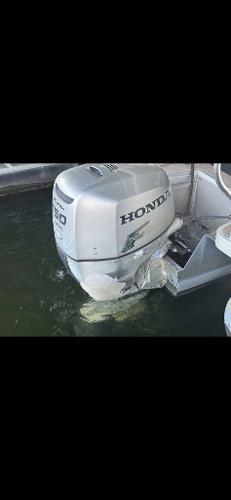 Slide: The Image of Honda outboard motor on 2005 Godfrey AquaPatio 240 LE pontoon boat. - 4