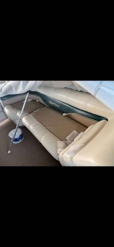 Slide: The Image of Interior of a 2005 Godfrey AquaPatio 240 LE pontoon boat with beige seating. - 9