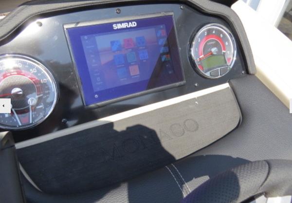Slide: The Image of 2023 Godfrey Monaco 235 SFL dashboard with Simrad display and gauges. - 10