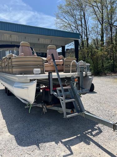 Slide: The Image of 2008 Godfrey SANPAN 2500 DC pontoon boat on trailer, parked outdoors. - 1