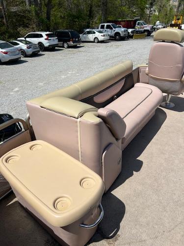 Slide: The Image of 2008 Godfrey SANPAN 2500 DC boat interior with beige seating and cup holders. - 12