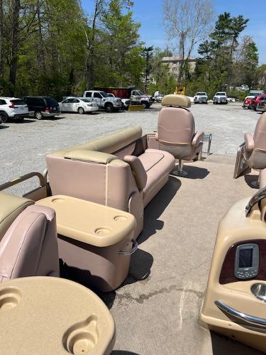 Slide: The Image of 2008 Godfrey SANPAN 2500 DC pontoon boat with beige seating, parked outdoors. - 4