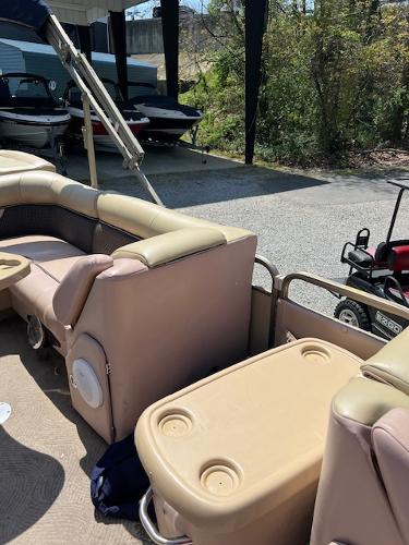 Slide: The Image of 2008 Godfrey SANPAN 2500 DC pontoon boat interior with beige seating and storage. - 5