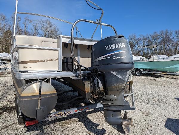 Slide: The Image of 2006 Godfrey Sweetwater pontoon boat with Yamaha outboard motor on trailer. - 2
