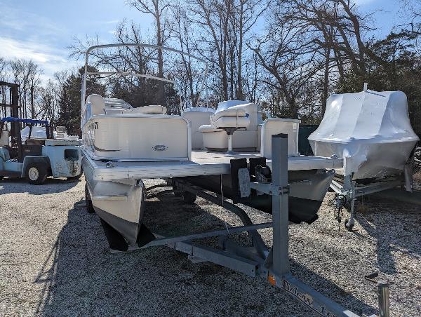 Slide: The Image of 2006 Godfrey Sweetwater pontoon boat on trailer, parked outdoors. - 5
