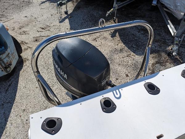 Slide: The Image of 2006 Godfrey Sweetwater boat with Yamaha outboard motor and stainless steel railing. - 9