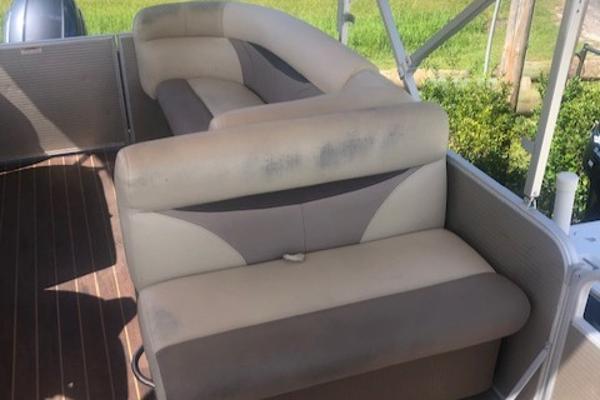 Slide: The Image of 2018 Godfrey Sweetwater 2286C boat interior with cushioned seating. - 8
