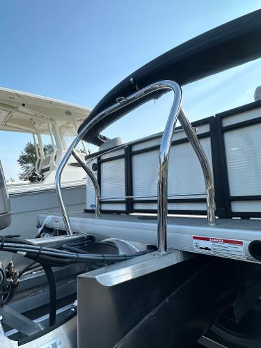 Slide: The Image of 2025 Godfrey SWEETWATER 2286 SB boat with stainless steel railings under clear blue sky. - 11
