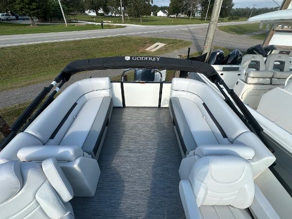 Slide: The Image of 2025 Godfrey SWEETWATER 2286 SB pontoon boat with spacious seating and sleek design. - 16