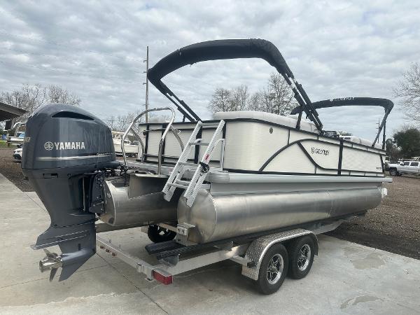 Slide: The Image of 2025 Godfrey SWEETWATER 2286 SB pontoon boat on trailer with Yamaha outboard motor. - 21