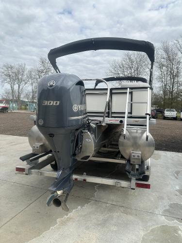 Slide: The Image of 2025 Godfrey SWEETWATER 2286 SB pontoon boat with Yamaha 300 engine, parked outdoors. - 3