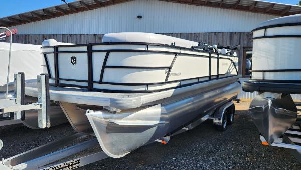 Slide: The Image of 2025 Godfrey SWEETWATER 2286 SB pontoon boat on trailer, parked outdoors. - 4