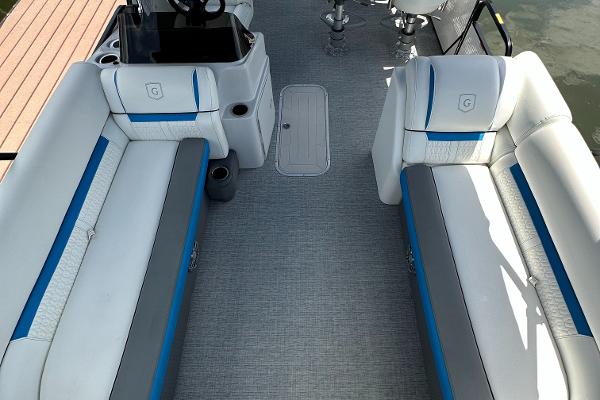 Slide: The Image of 2022 Godfrey Sw Mid Table Tri-Toon interior with white and blue seating. - 3
