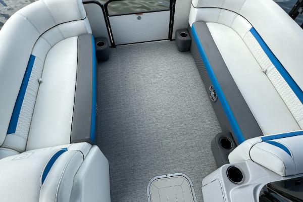 Slide: The Image of 2022 Godfrey Sw Mid Table Tri-Toon interior with white and blue seating. - 4