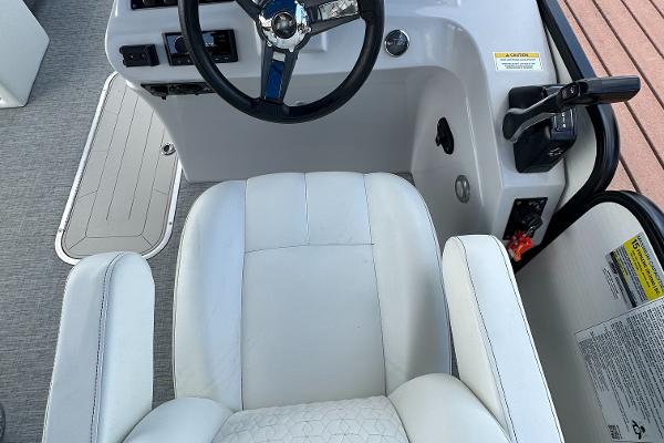Slide: The Image of Captain's chair and helm of 2022 Godfrey Sw Mid Table Tri-Toon boat. - 5