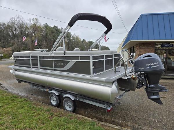 Slide: The Image of 2024 Godfrey Xperience 2286 SBX pontoon boat with Yamaha outboard motor on trailer. - 1