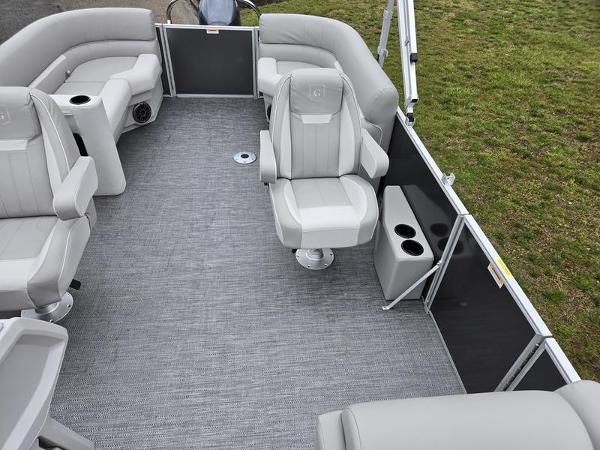 Slide: The Image of 2024 Godfrey Xperience 2286 SBX pontoon boat interior with gray seating and flooring. - 17