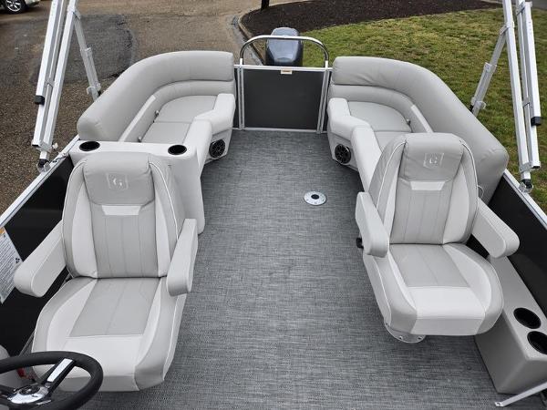 Slide: The Image of 2024 Godfrey Xperience 2286 SBX pontoon boat interior with plush seating and modern design. - 2