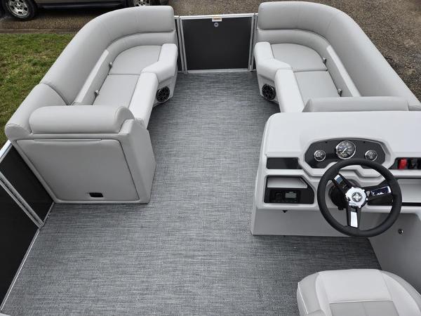 Slide: The Image of 2024 Godfrey Xperience 2286 SBX pontoon boat interior with gray seating and steering console. - 3