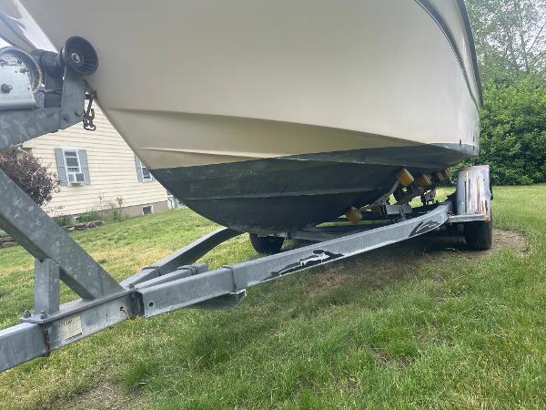 Slide: The Image of 1998 Grady-White Adventure 208 boat on trailer, parked on grass. - 15