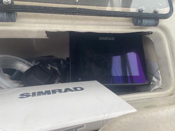 Slide: The Image of Simrad equipment inside a 1998 Grady-White Adventure 208 boat compartment. - 8