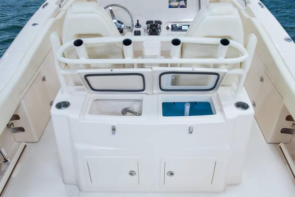 Slide: The Image of Manufacturer Provided Image: 2019 Grady-White Canyon 306 boat interior with rod holders and storage compartments. - 11