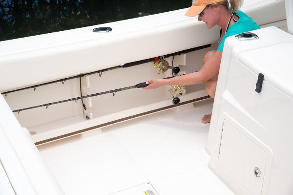 Slide: The Image of Manufacturer Provided Image: Woman storing fishing rod on 2019 Grady-White Canyon 306 boat. - 15