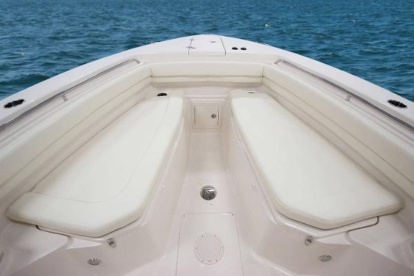Slide: The Image of Manufacturer Provided Image: 2019 Grady-White Canyon 306 boat interior with cushioned seating, ocean background. - 6