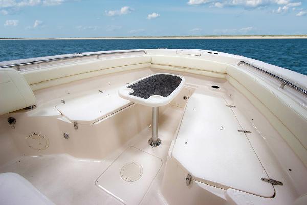 Slide: The Image of Manufacturer Provided Image: 2019 Grady-White Canyon 306 boat interior with seating and table on open water. - 8
