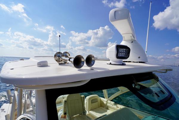 Slide: The Image of 2016 Grady-White Express 330 boat with radar and horn on open sea. - 10